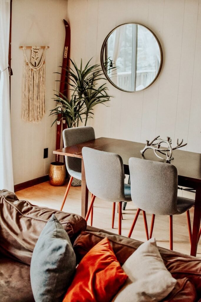 A modern chalet interior featuring a mix of contemporary furniture and natural decor elements.