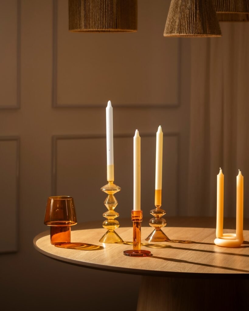 Candles and decor are arranged on a table.