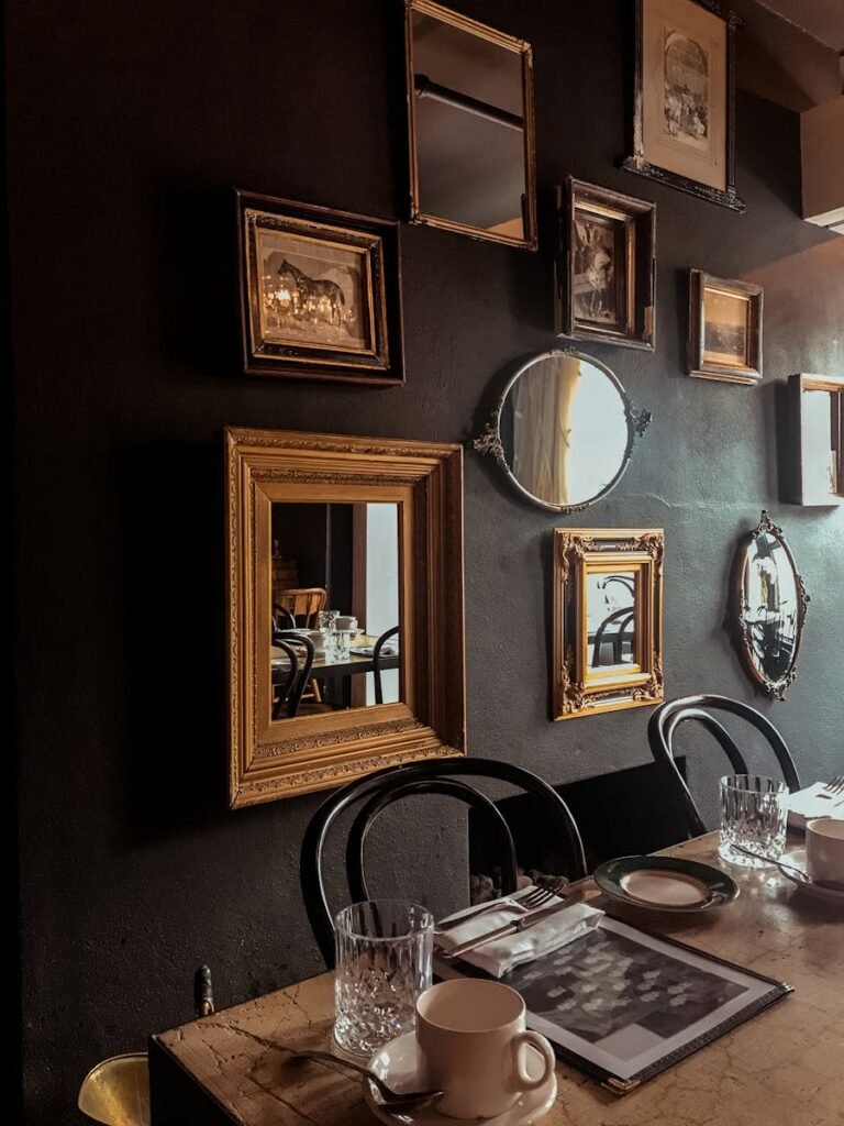 Cozy dining room with vintage mirrors and elegant table setting.