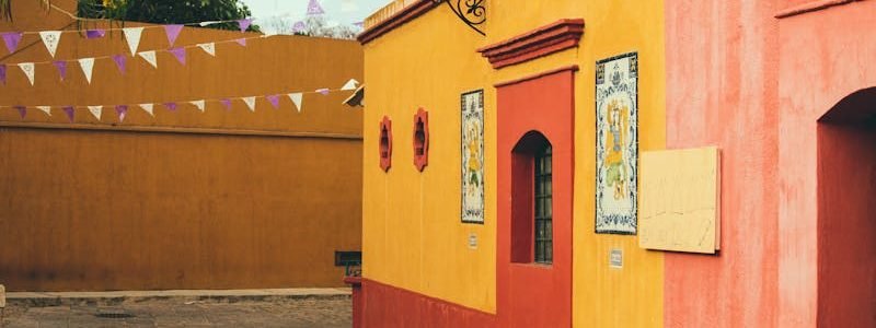 Colorful colonial buildings in a peaceful street in Oaxaca, capturing Mexican architectural essence.