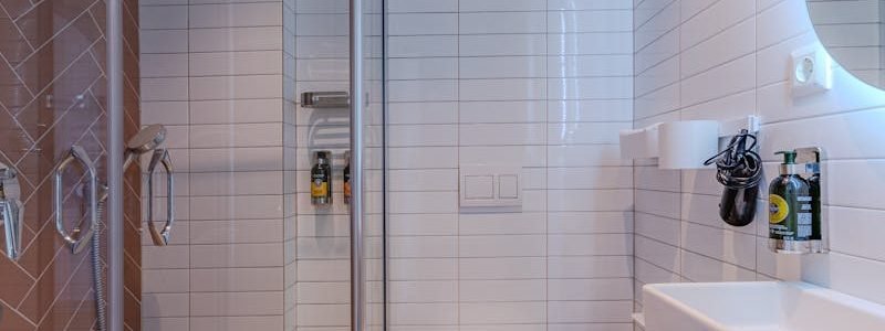 Elegant bathroom design featuring a glass shower and sleek fixtures.